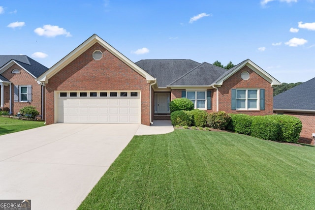 single story home featuring brick siding, a garage, a front lawn, and concrete driveway