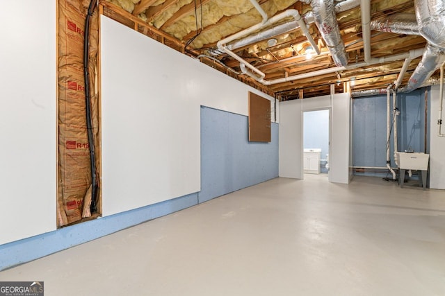 unfinished below grade area with a sink