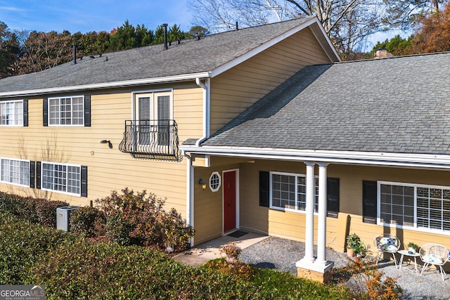 1468 Briarwood Rd NE Unit 2003, Atlanta, GA 30319 - traditional-style house featuring a shingled roof and a balcony