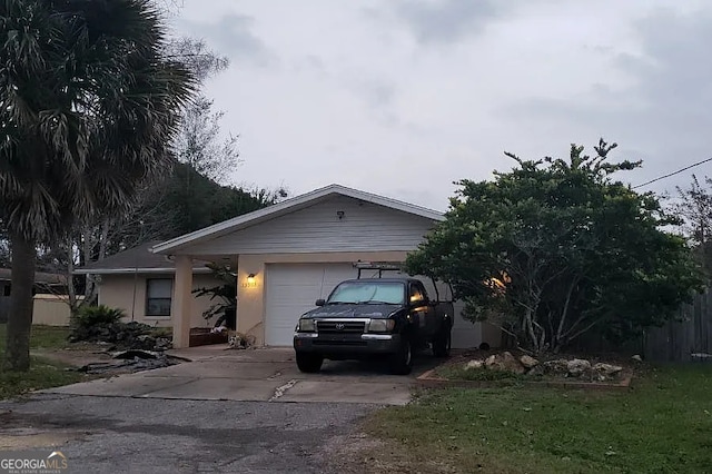 single story home with an attached garage and driveway