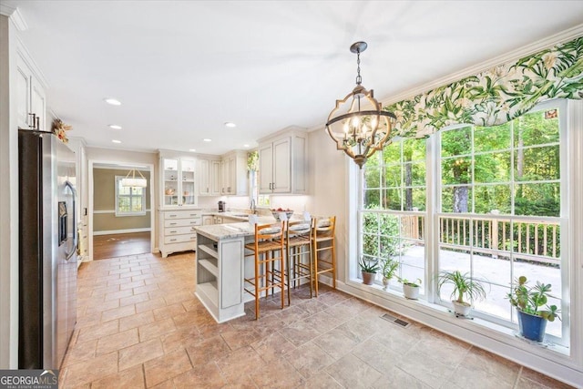 4802 Wesleyan Woods Dr, Macon, GA 31210 - kitchen featuring visible vents, open shelves, baseboards, a peninsula, and stainless steel fridge