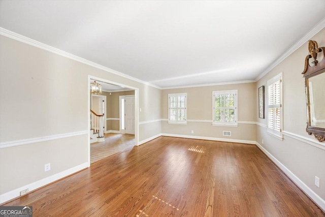 4802 Wesleyan Woods Dr, Macon, GA 31210 - interior space featuring visible vents, crown molding, wood finished floors, a notable chandelier, and stairs