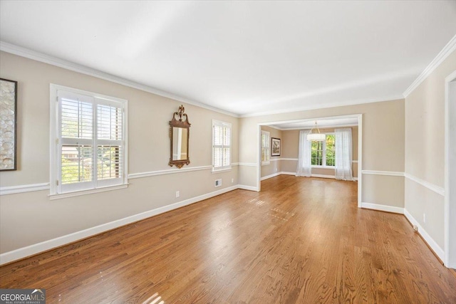 4802 Wesleyan Woods Dr, Macon, GA 31210 - unfurnished room with crown molding, baseboards, and wood finished floors