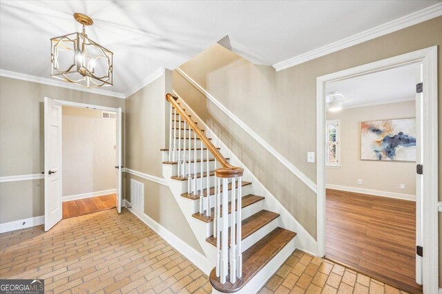 4802 Wesleyan Woods Dr, Macon, GA 31210 - staircase featuring crown molding, baseboards, brick floor, and a notable chandelier