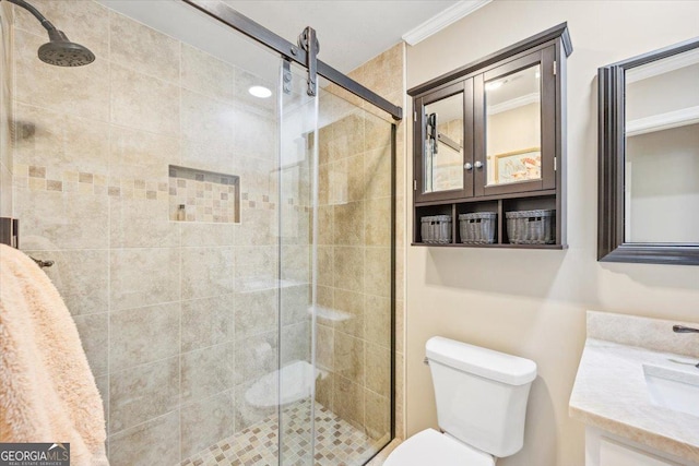 4802 Wesleyan Woods Dr, Macon, GA 31210 - bathroom featuring vanity, ornamental molding, a shower stall, and toilet