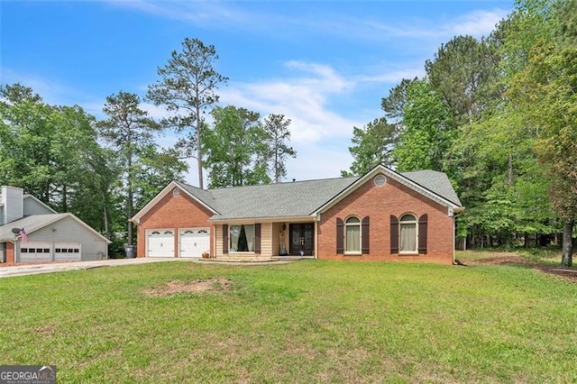 single story home with a garage, driveway, a front lawn, and brick siding