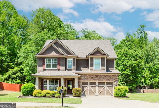 674 Chadmon Court Trce, Dacula, GA 30019 - craftsman inspired home featuring driveway, a garage, and stone siding