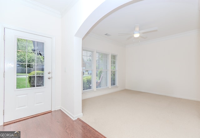 674 Chadmon Court Trce, Dacula, GA 30019 - carpeted entryway featuring arched walkways, ceiling fan, and crown molding