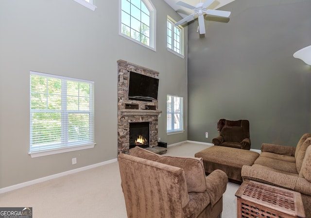 674 Chadmon Court Trce, Dacula, GA 30019 - carpeted living room with a high ceiling, ceiling fan, and a fireplace