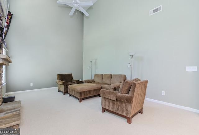 674 Chadmon Court Trce, Dacula, GA 30019 - living area with light carpet, a high ceiling, and a ceiling fan