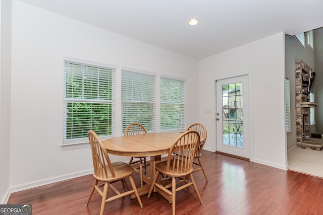 674 Chadmon Court Trce, Dacula, GA 30019 - dining space with wood finished floors, a fireplace, and recessed lighting