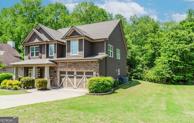 674 Chadmon Court Trce, Dacula, GA 30019 - craftsman-style house with concrete driveway, a front yard, stone siding, and an attached garage