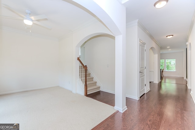 674 Chadmon Court Trce, Dacula, GA 30019 - entryway featuring ornamental molding, a ceiling fan, dark wood-style flooring, stairs, and arched walkways
