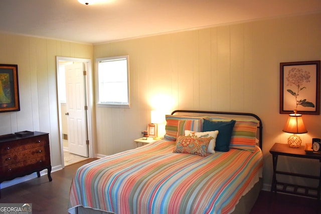 bedroom featuring wood finished floors