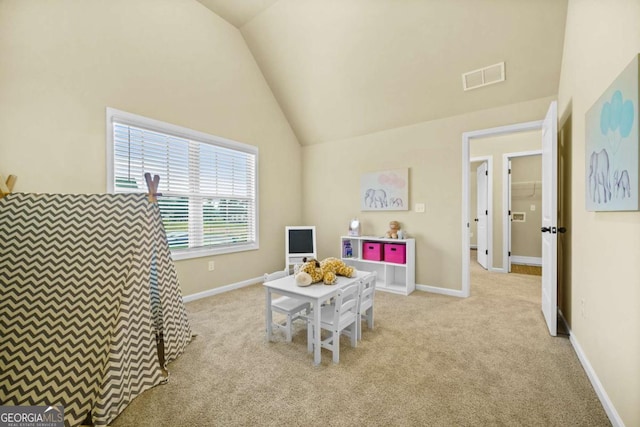 recreation room featuring visible vents, baseboards, carpet, and lofted ceiling