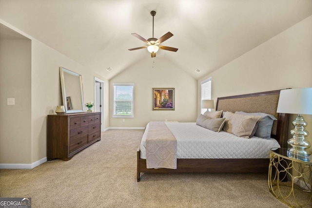 carpeted bedroom featuring baseboards, ceiling fan, and vaulted ceiling