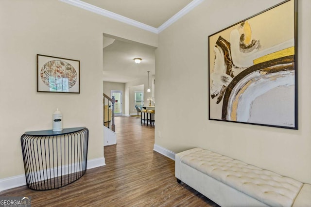corridor with baseboards, stairs, crown molding, and wood finished floors