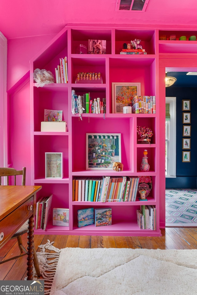 room details with visible vents and wood finished floors