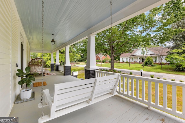 view of patio / terrace with a porch and a residential view