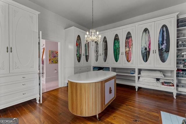 interior space featuring a chandelier and dark wood-style floors