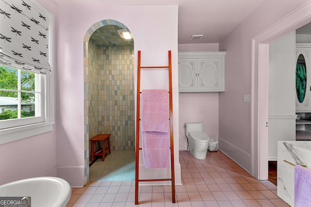 full bath with walk in shower, toilet, tile patterned floors, baseboards, and visible vents