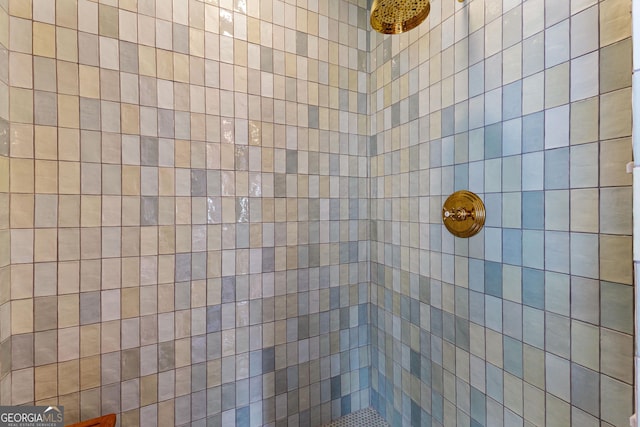 bathroom with a tile shower