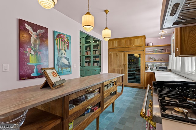 kitchen featuring pendant lighting, open shelves, ventilation hood, beverage cooler, and dark floors