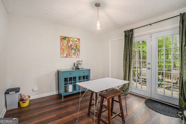 2623 Riggs Dr, Atlanta, GA 30344 - dining area with baseboards, french doors, dark wood finished floors, and a textured ceiling
