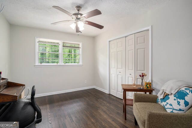 2623 Riggs Dr, Atlanta, GA 30344 - office area with baseboards, ceiling fan, a textured ceiling, and dark wood-type flooring