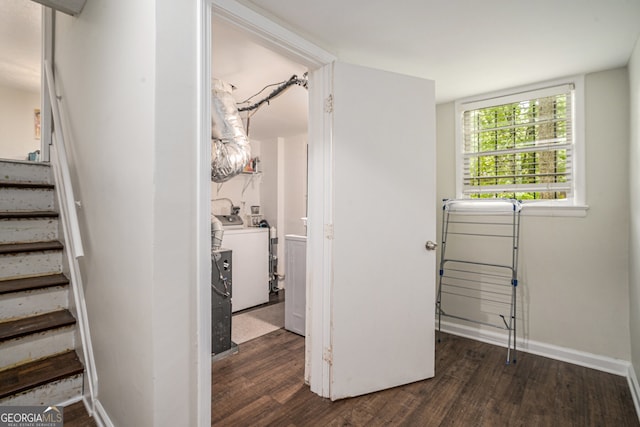 2623 Riggs Dr, Atlanta, GA 30344 - hallway with washing machine and clothes dryer, baseboards, stairway, and dark wood-type flooring