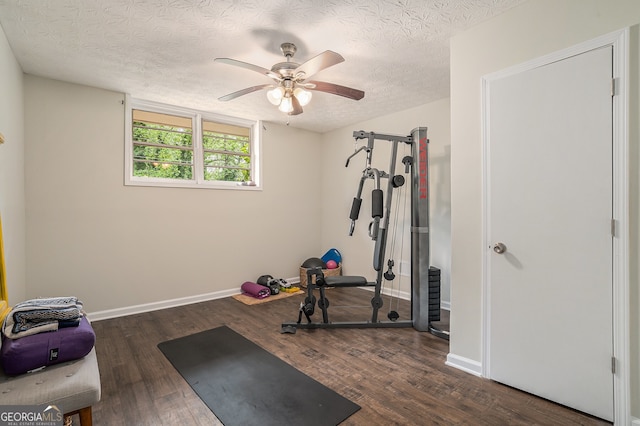 2623 Riggs Dr, Atlanta, GA 30344 - workout area featuring baseboards, a textured ceiling, ceiling fan, and wood finished floors