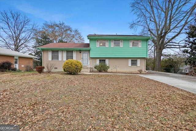 6100 Prestige Valley Rd, Morrow, GA 30260 - tri-level home with brick siding, fence, and driveway