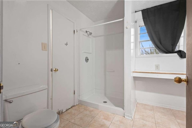 6100 Prestige Valley Rd, Morrow, GA 30260 - bathroom with toilet, tile patterned floors, and a stall shower