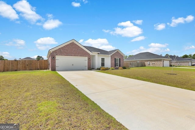 481 Akins Ranch Rd NE, Ludowici, GA 31316 - ranch-style home with a front lawn, fence, brick siding, concrete driveway, and an attached garage
