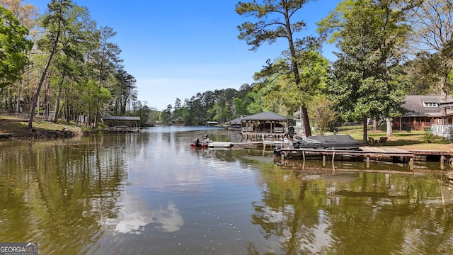 175 Mayo Rd, Covington, GA 30014 - view of dock with boat lift and a water view