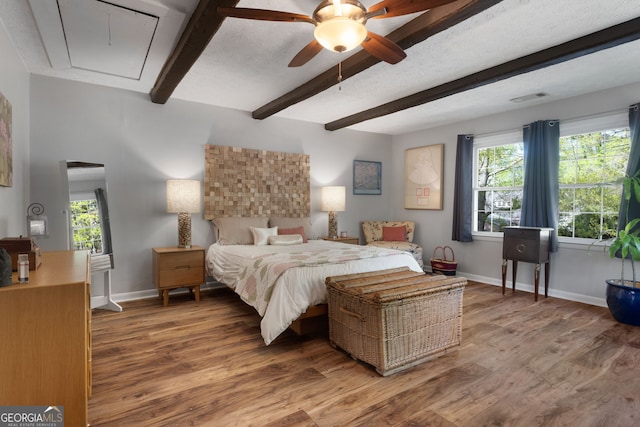 175 Mayo Rd, Covington, GA 30014 - bedroom with visible vents, attic access, multiple windows, and beamed ceiling