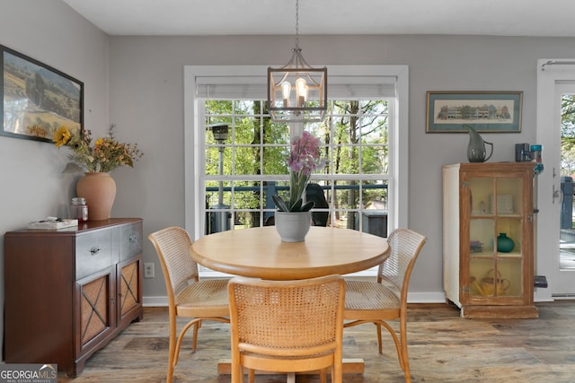 175 Mayo Rd, Covington, GA 30014 - dining room with light wood-style floors, plenty of natural light, and a notable chandelier