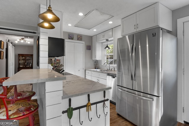 175 Mayo Rd, Covington, GA 30014 - kitchen featuring white cabinets, stainless steel appliances, recessed lighting, and a sink