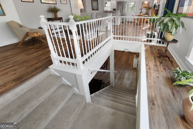175 Mayo Rd, Covington, GA 30014 - stairs with baseboards and wood finished floors