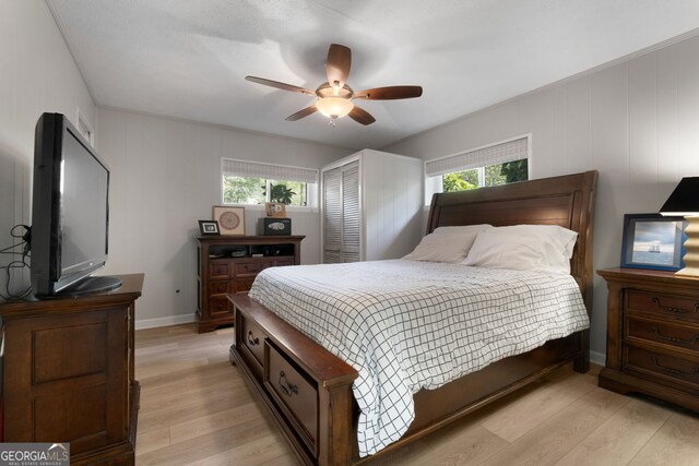 175 Mayo Rd, Covington, GA 30014 - bedroom with ceiling fan, multiple windows, and light wood-style flooring