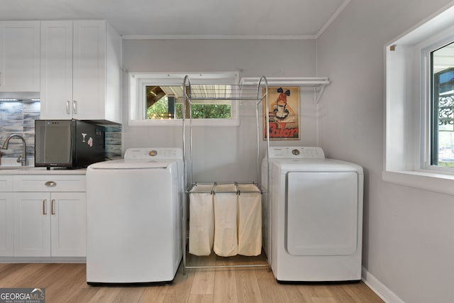 175 Mayo Rd, Covington, GA 30014 - laundry area with plenty of natural light, ornamental molding, and independent washer and dryer