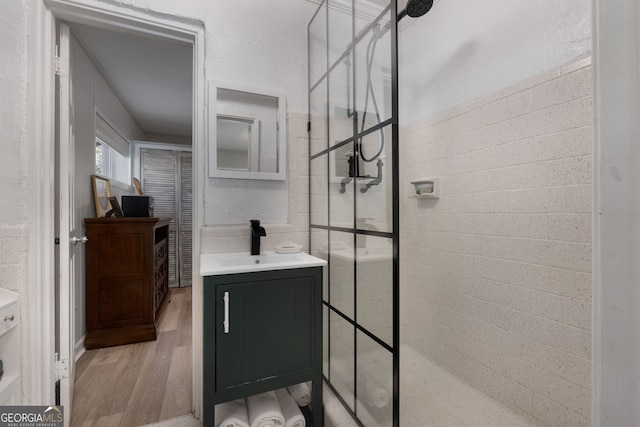175 Mayo Rd, Covington, GA 30014 - full bathroom with vanity, walk in shower, and wood finished floors