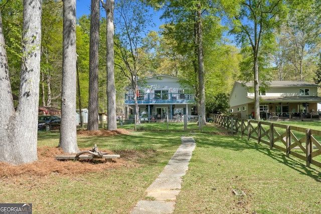 175 Mayo Rd, Covington, GA 30014 - view of front of home featuring a front lawn, fence, and a wooden deck
