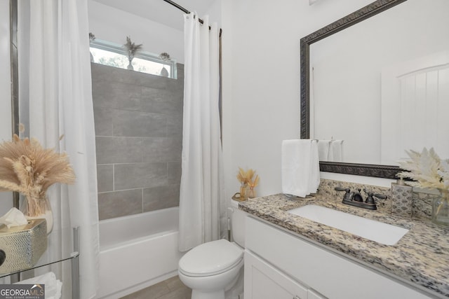 bathroom with toilet, shower / bath combo with shower curtain, and vanity