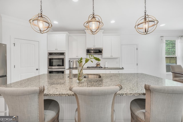 kitchen featuring recessed lighting, appliances with stainless steel finishes, and decorative light fixtures