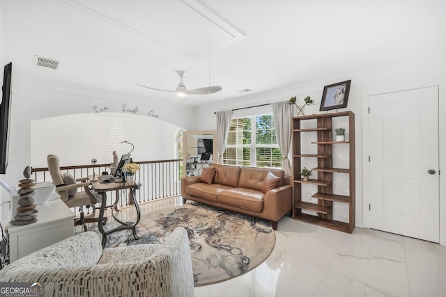 living room with crown molding, marble finish floor, visible vents, and attic access