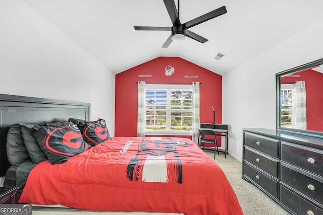 carpeted bedroom with a ceiling fan, visible vents, multiple windows, and lofted ceiling