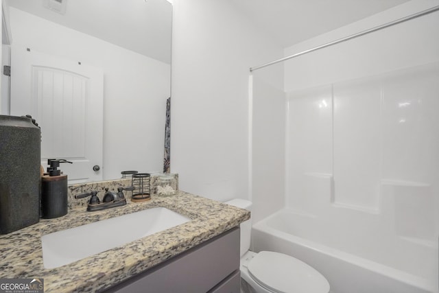 full bathroom featuring visible vents, shower / bathing tub combination, toilet, and vanity
