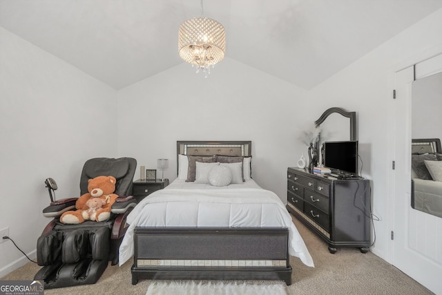 bedroom with carpet floors, a notable chandelier, and vaulted ceiling