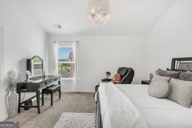 bedroom featuring visible vents, baseboards, carpet floors, and a notable chandelier